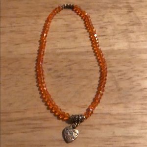 Orange anklet with heart accent